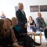 A moment from defense. The review of the President of Lithuanian Graphic Association Gediminas Lašas (standing).